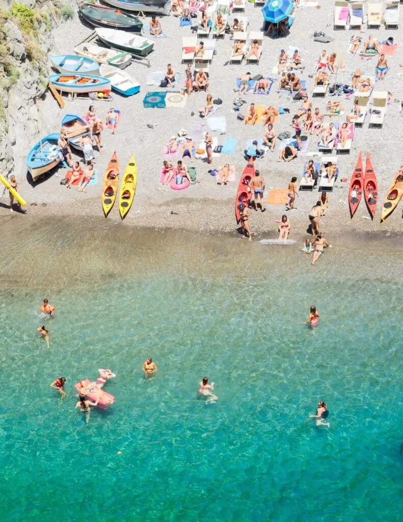 people swimming and sunbathing on the Amalfi coast